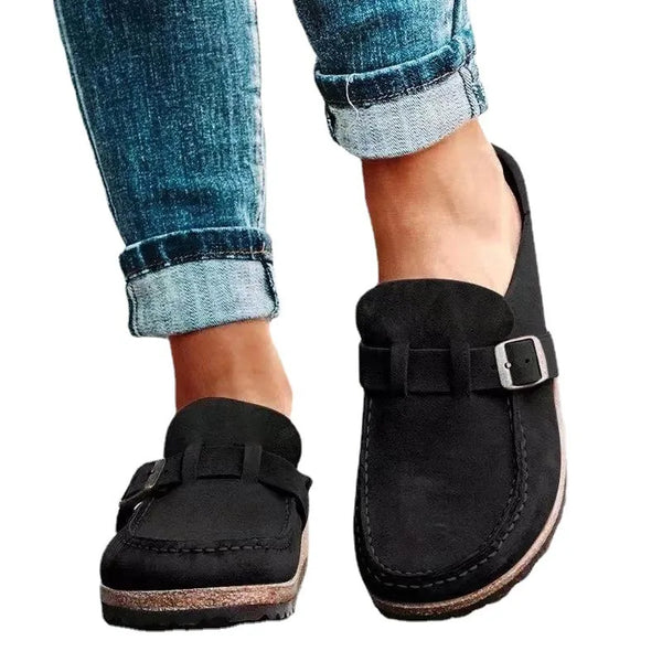 Women's flat mules featuring vintage-inspired buckle strap and cushioned EVA insole for all-day comfort