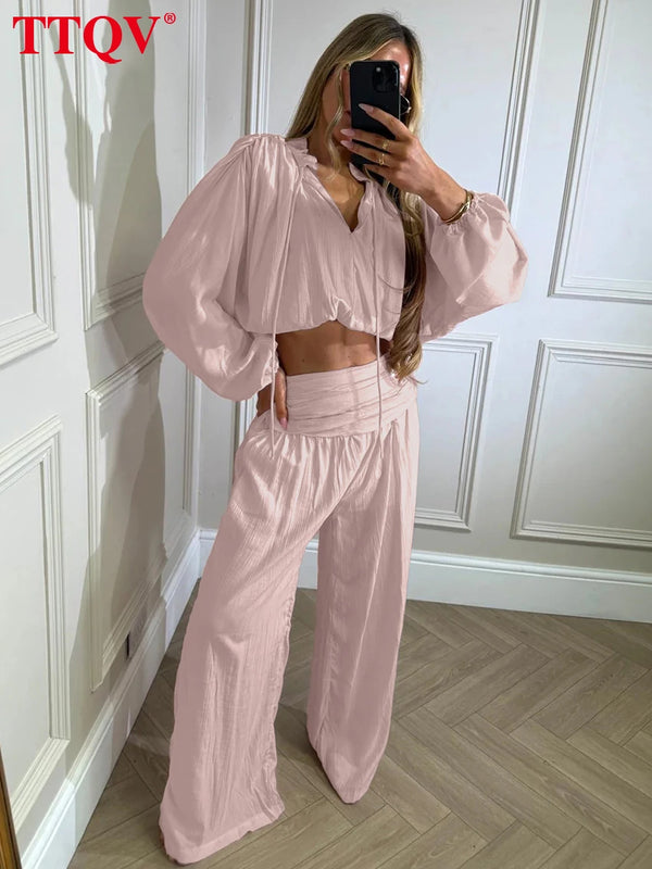 Wide-leg palazzo pants paired with matching stand collar blouse in premium fabric