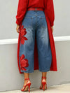 High-waisted cropped denim jeans with relaxed wide leg fit and floral texture detail