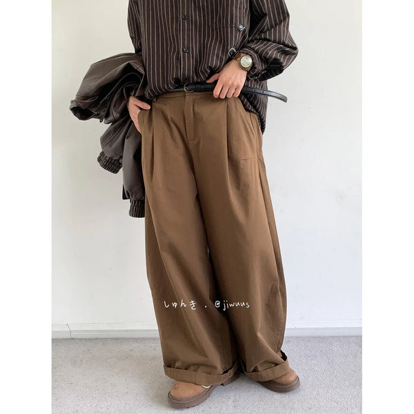 Model pairing Midnight Rendezvous Trousers with a casual shirt for a night-out look.