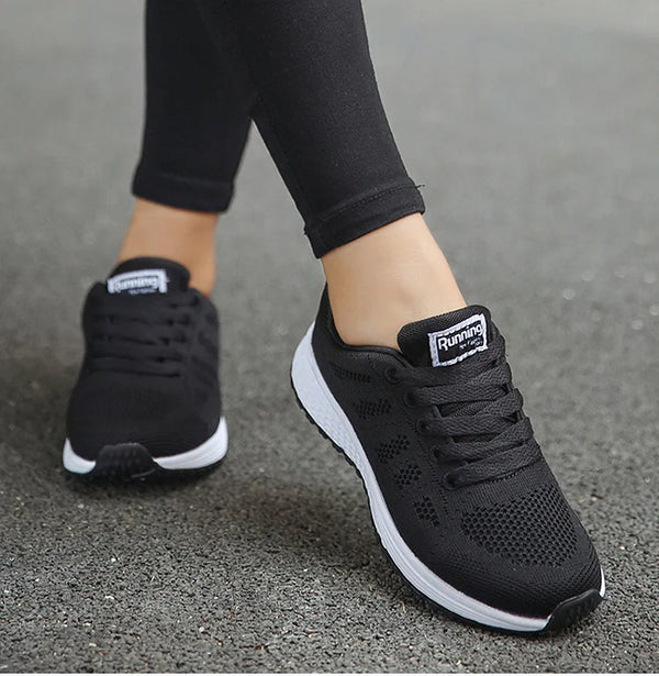 Women's white sports shoes with breathable lining and colorful design