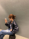 Chic cropped leather jacket for women in premium faux leather, featuring a stylish turn-down collar and secure zipper closure