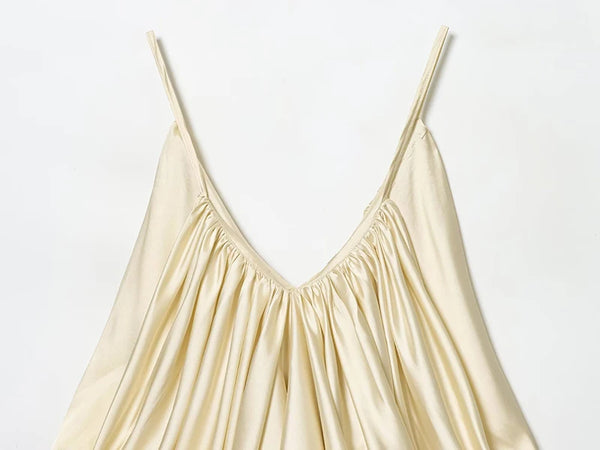 Premium satin party top with flattering pleats and bare back detail