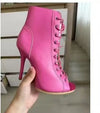 Heel detail of snake-print stiletto ankle boots showing height
