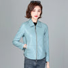 Chic women's sheepskin leather jacket with zippered front, turn-down collar, and pockets for stylish autumn layering.