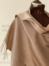 Elegant women's scarf in soft blush pink, perfect for adding warmth to any outfit.