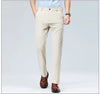Breathable stretch pants in black paired with white dress shirt for classic business attire