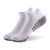 Non-slip grip detail on athletic socks, ensuring stability and preventing shifts during runs.
