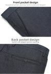 Flat lay of anti-wrinkle polyester trousers showing clean, pressed appearance