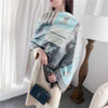 Elegant winter accessory: Cozy Cashmere Embrace scarf in soft gray.