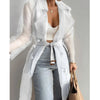 Belted trench coat in sheer fabric transitioning from spring mornings to summer evenings