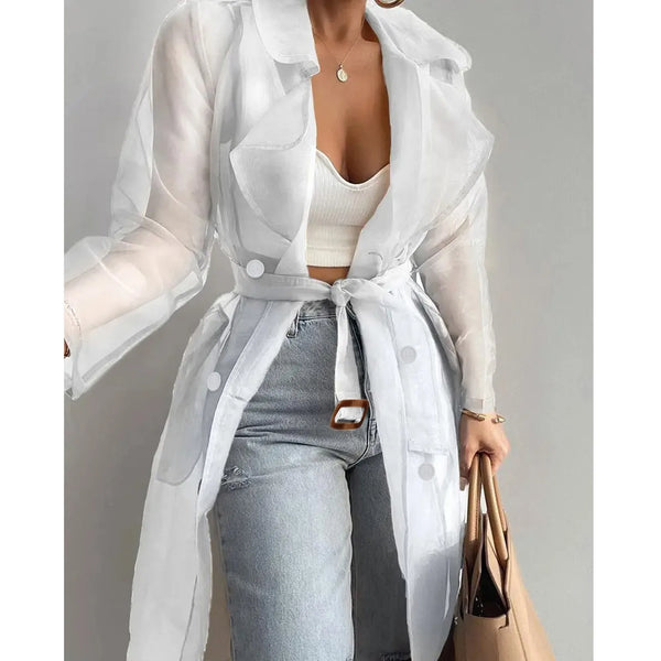 Belted trench coat in sheer fabric transitioning from spring mornings to summer evenings
