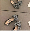 Pointed toe flat sandals in beige with decorative bow and all-day comfort technology
