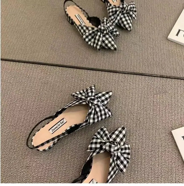 Pointed toe flat sandals in beige with decorative bow and all-day comfort technology