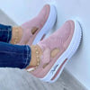 Side angle view of white mesh platform sneakers with subtle lift and lace closure