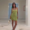 Dazzling emerald cocktail dress with all-over sequins and playful fringe hemline