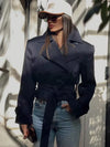 Chic beige trench coat with iconic double-breasted button closure