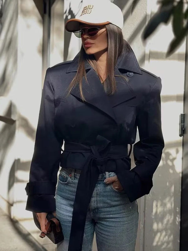 Chic beige trench coat with iconic double-breasted button closure