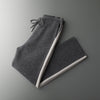 Detail of the zip closure on the Merino wool cardigan, highlighting its modern design.