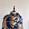 Elegant shawl wrap made from premium cashmere blend.