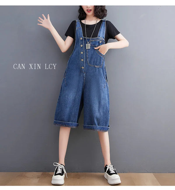 Relaxed baggy denim jumpsuit in solid color with vintage suspenders for contemporary streetwear