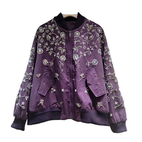 Three-quarter view of embroidered jacket highlighting collar and zipper design