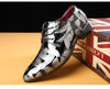 Side profile of men's dress shoes with floral design and rubber sole.