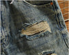 Rebel Spirit Distressed Jeans styled with a flannel shirt for a rugged look.