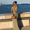 Floor-length halter dress with zip closure and eye-catching waist cutout details
