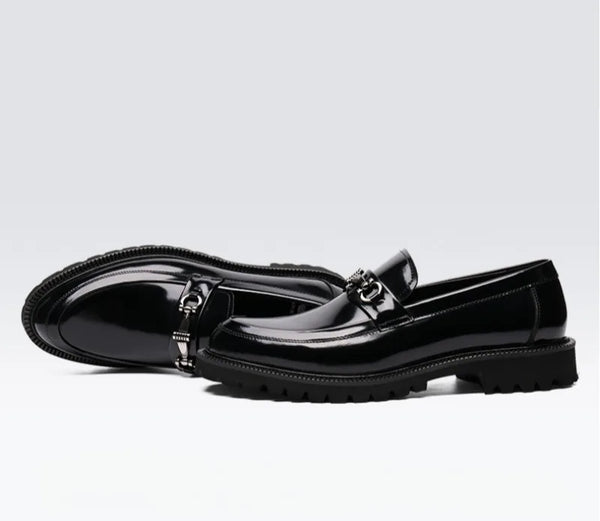 Black Oxfords on a desk, ready for a high-stakes meeting.