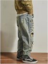 Close-up of the waistband and stitching on Rebel Spirit Distressed Jeans, showcasing quality.