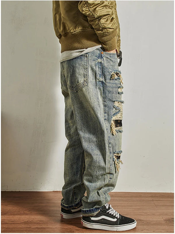 Close-up of the waistband and stitching on Rebel Spirit Distressed Jeans, showcasing quality.