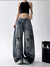 Trendy high-waist wide-leg ripped jeans for women with tie-dye and distressed detailing, perfect for casual street style.