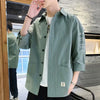 Stylish Harajuku-Inspired Men's Casual Shirt in solid color, perfect for urban fashion and versatile styling. Lightweight pol