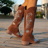 Embroidered mid-calf women's fashion boots with low wedge heel, slip-on design, and durable rubber outsole for comfort and st