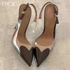 Transparent formal heels with pointed toe and buckle strap detail