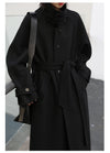 Classic long coat with turtleneck collar and adjustable waist cinch