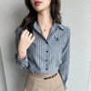 Chic striped blouse for office elegance, featuring a turn-down collar and single-breasted button front, perfect for professio