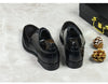 Handcrafted black leather Oxfords showcasing impeccable craftsmanship.