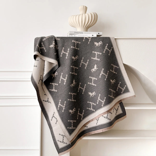 Chic winter accessory: cashmere shawl with artistic floral details.