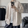 Oversized long sleeve casual shirt for men and women, featuring a Mandarin collar and single-breasted closure in solid color.