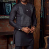Men's cultural celebration outfit featuring vibrant patchwork panels in traditional African prints