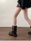 Chic women's mid-calf biker boots with buckle detail, cozy plush lining, and durable rubber sole for stylish winter wear.