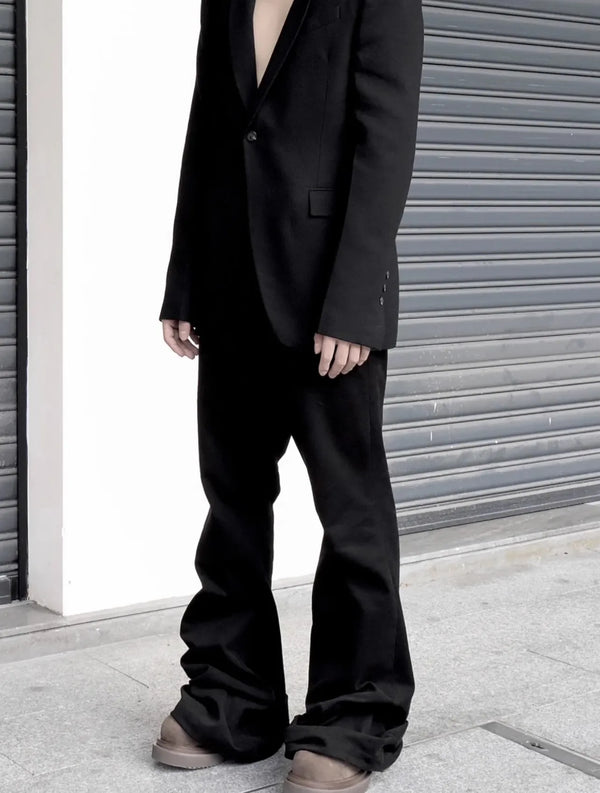 Midnight Voyager jeans styled with a trendy jacket for a stylish urban look.