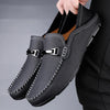Elegant grey leather loafers for men, perfect for smart-casual occasions.