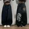 Artistic flair on casual jeans, perfect for hip hop fashion lovers.