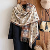 Luxe cashmere-feel scarf in soft gray, perfect for winter warmth and style.