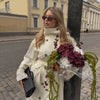 Cream colored outerwear trench coat with long length extending past hips