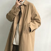 Chic Japanese vintage trench coat for men in black, featuring a single-breasted closure and stylish turn-down collar.
