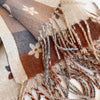 Stylish winter scarf featuring a unique print, ideal for chic layering.